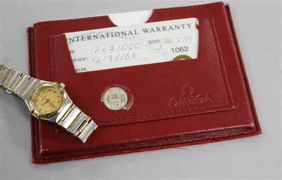 A ladys steel and gold Omega Constellation quartz wrist watch, with warranty.